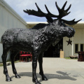 estatua de alces de bronce